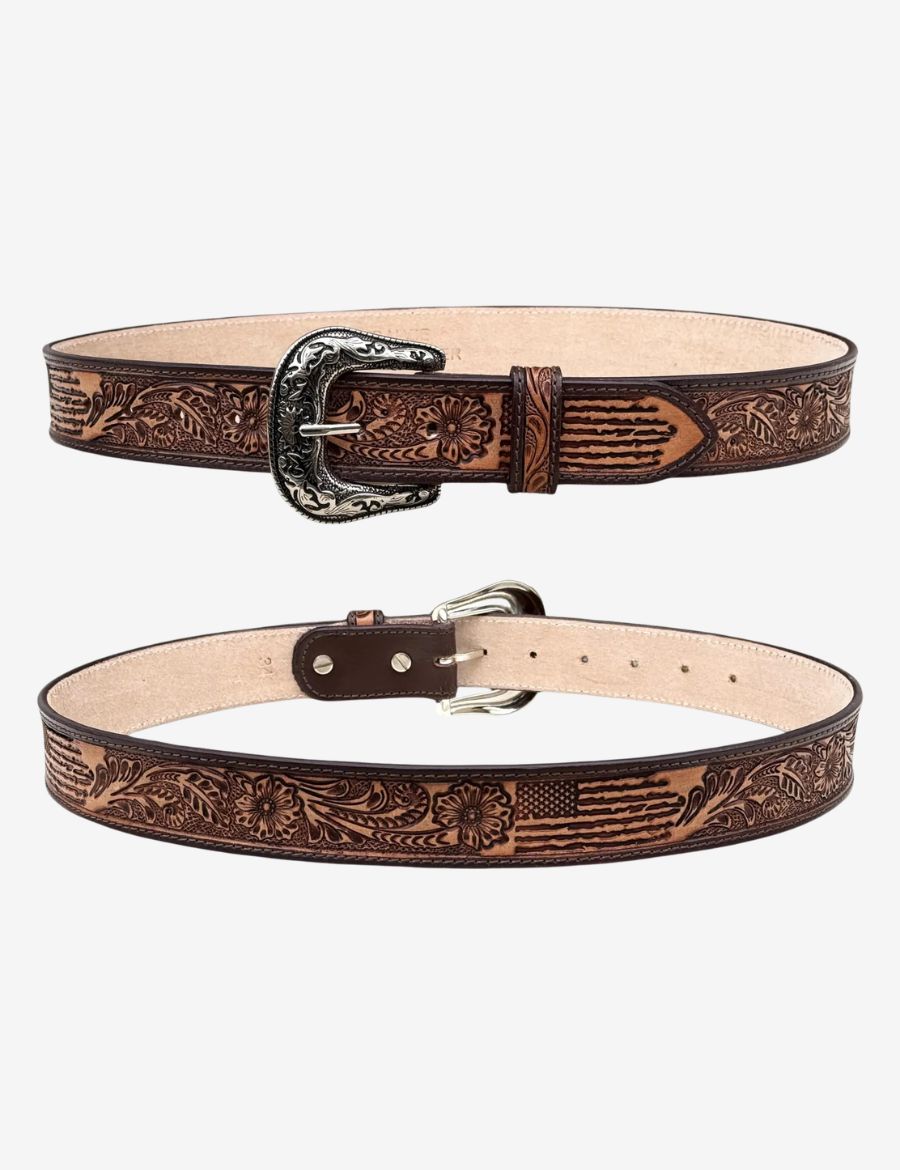 Western leather belt featuring American flag tooling, floral carvings, and an engraved silver cowboy buckle.