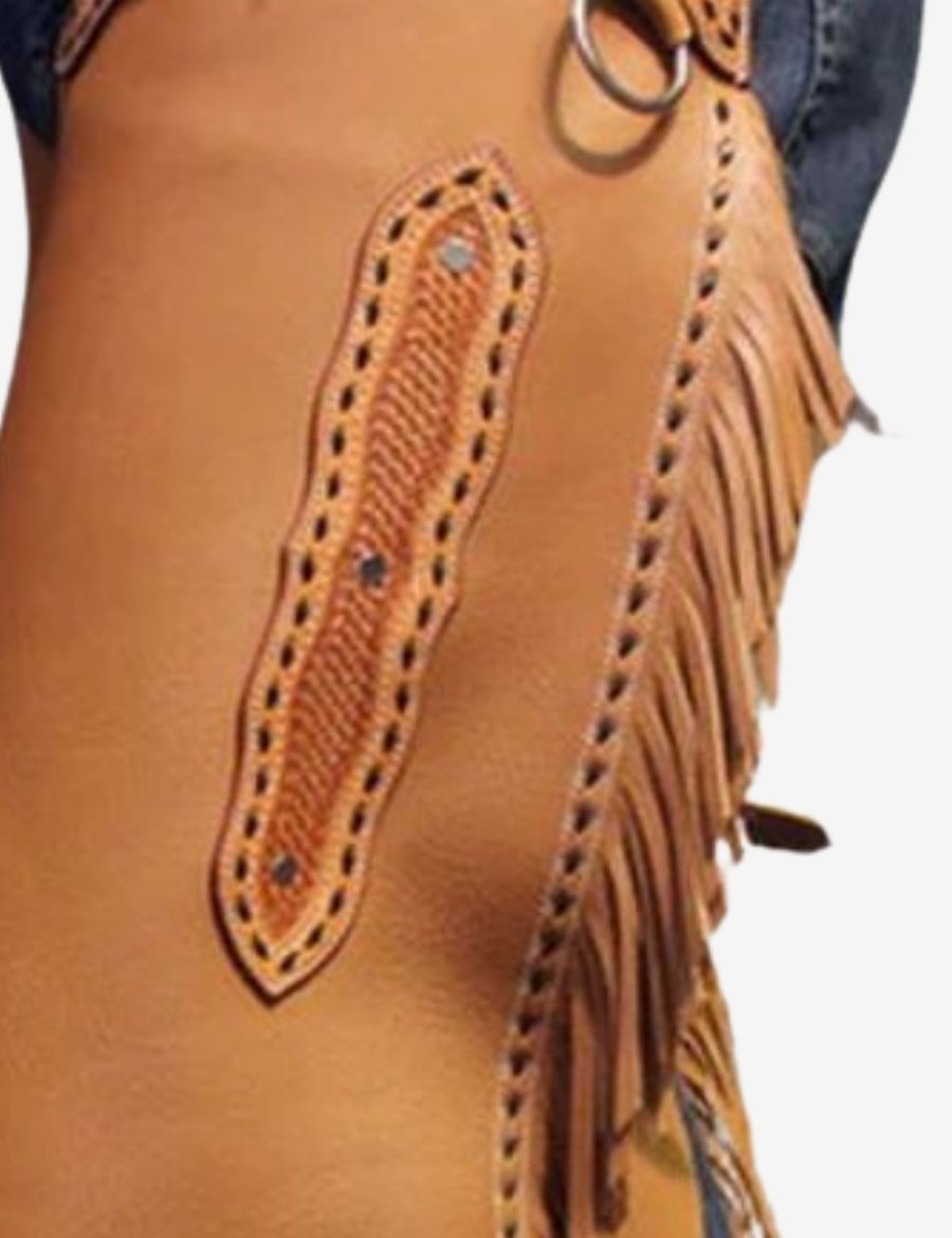 Close-up of basketweave cowhide leather chinks chaps highlighting stitched tooling and fringe craftsmanship.
