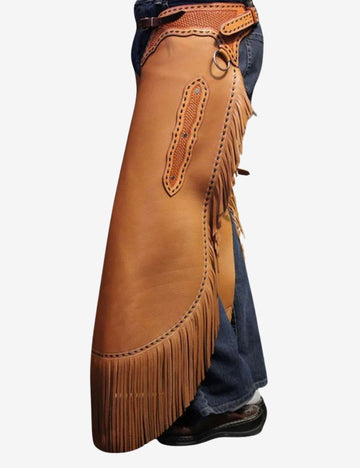 Side model view of basketweave cowhide leather chinks chaps with fringe and handcrafted western styling.