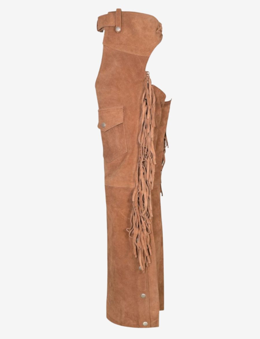 Side profile of beige womens western chaps with fringe highlighting flowing tassels, suede leather, and cowgirl-inspired design.