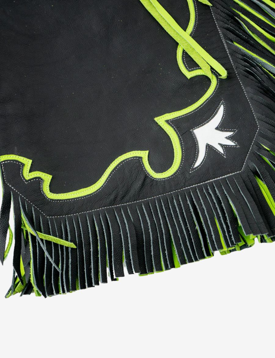 Fringe detail view of black rodeo chaps with layered black and neon green leather fringe and western trim.