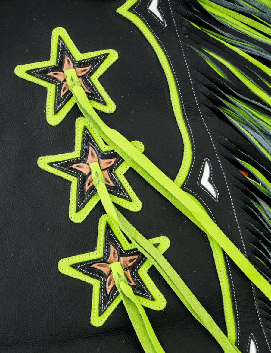 Detailed view of black rodeo chaps with neon green star overlays and braided western leather accents.