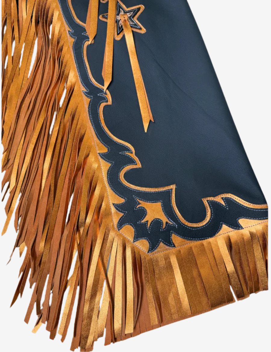 Close-up of black rodeo chaps with flowing gold fringe, western border trim, and handcrafted rodeo leather accents.