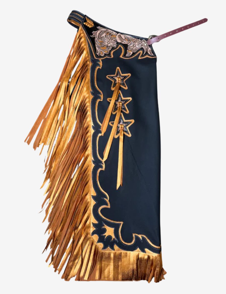 Black rodeo chaps with gold fringe featuring floral tooling, star conchos, and bold western bull riding styling.