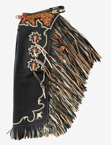 Black rodeo chaps with floral tooled yoke, layered tan and black fringe, and western leather detailing.