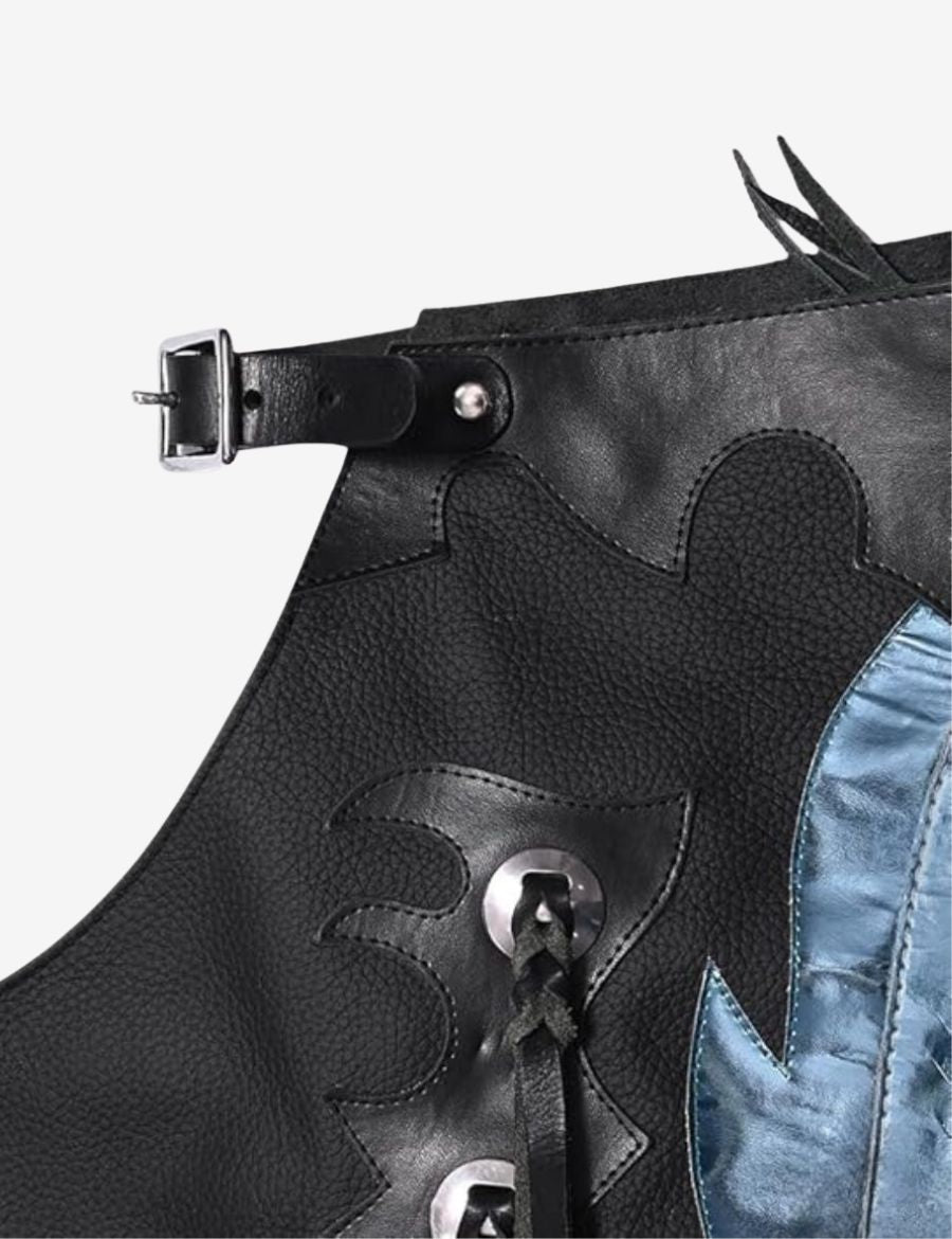 Close-up yoke view of black rodeo chaps with metallic fringe featuring hand tooled leather and western rodeo detailing.