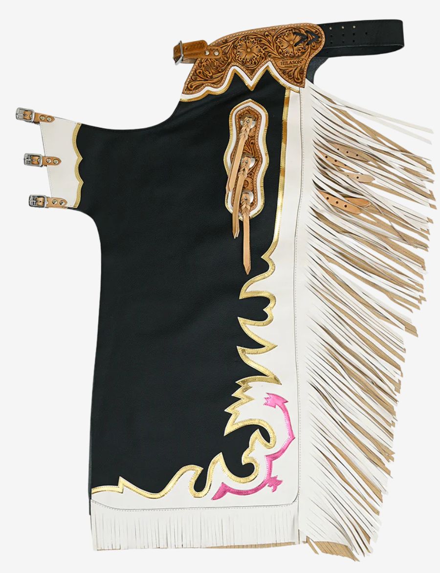 Black rodeo chaps with off white fringe, floral tooled leather yoke, and gold trim detailing.
