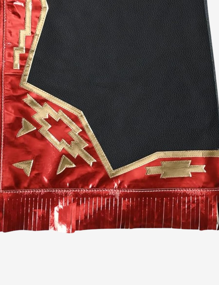Detailed fringe view of black leather rodeo chaps showcasing flowing metallic red fringe and rodeo craftsmanship.
