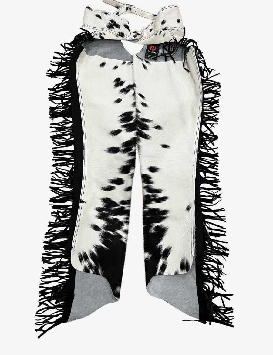 Back view of black and white hair-on hide western chaps with genuine cowhide leather and western rodeo design.