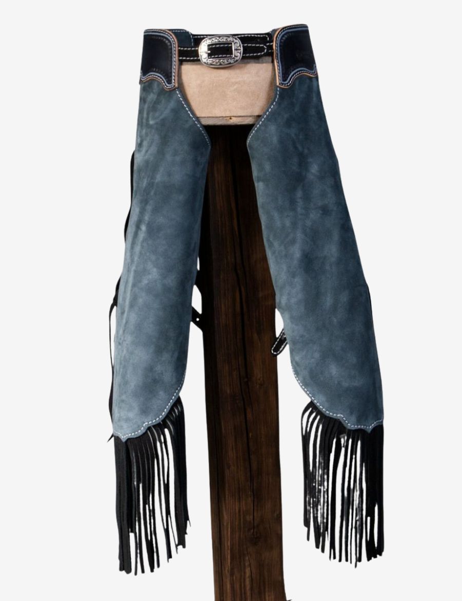 Angled front view of blue suede cowboy chinks chaps featuring black leather fringe, conchos, and western detailing.