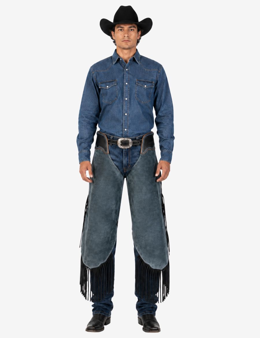 Full front model view wearing blue suede chinks chaps for cowboy with black fringe and western belt styling.