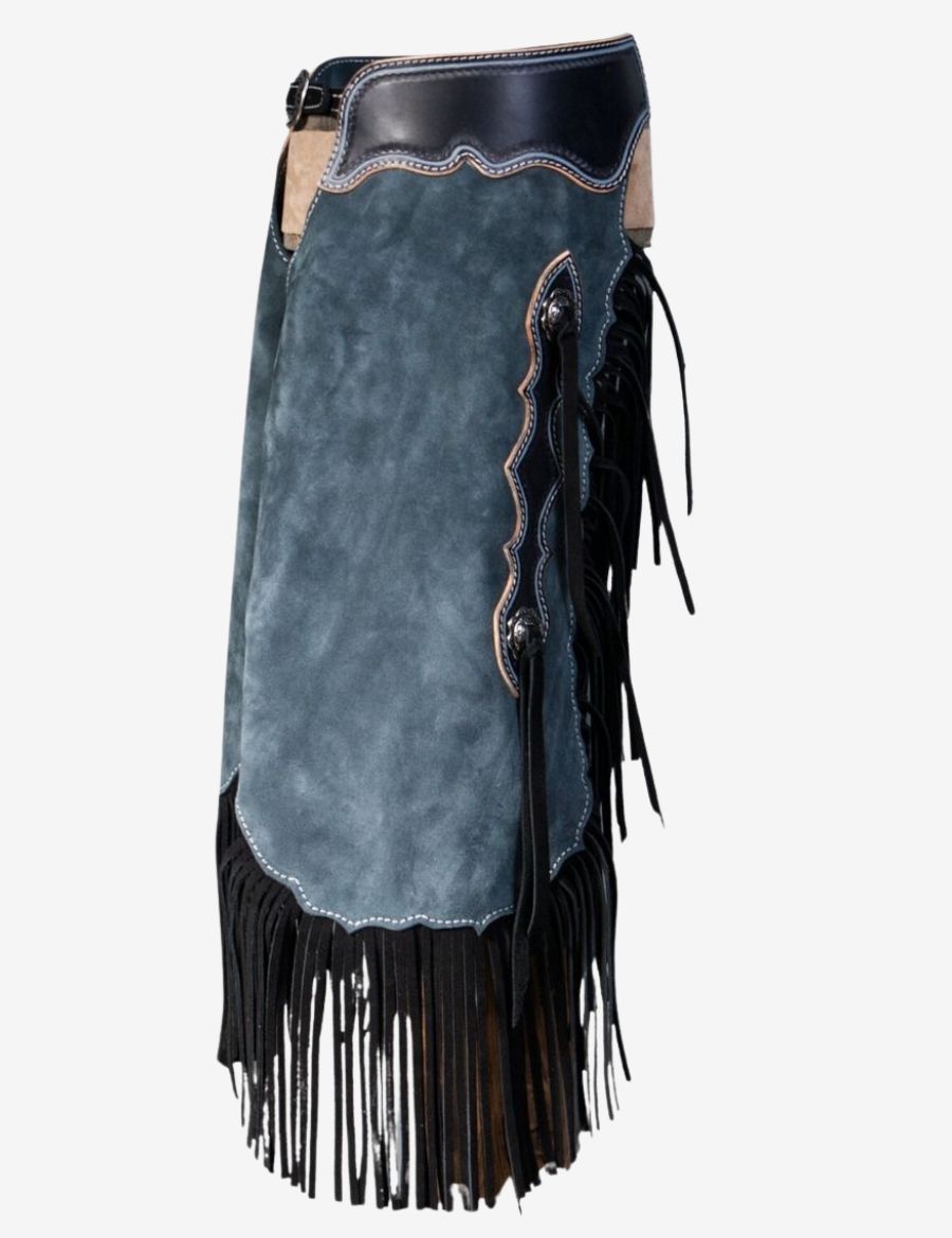 Side view of blue suede chinks chaps for cowboy with layered fringe, scalloped trim, and decorative conchos.