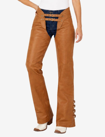 Angled front view of brown leather chaps for women with smooth leather finish and side buckle accents.