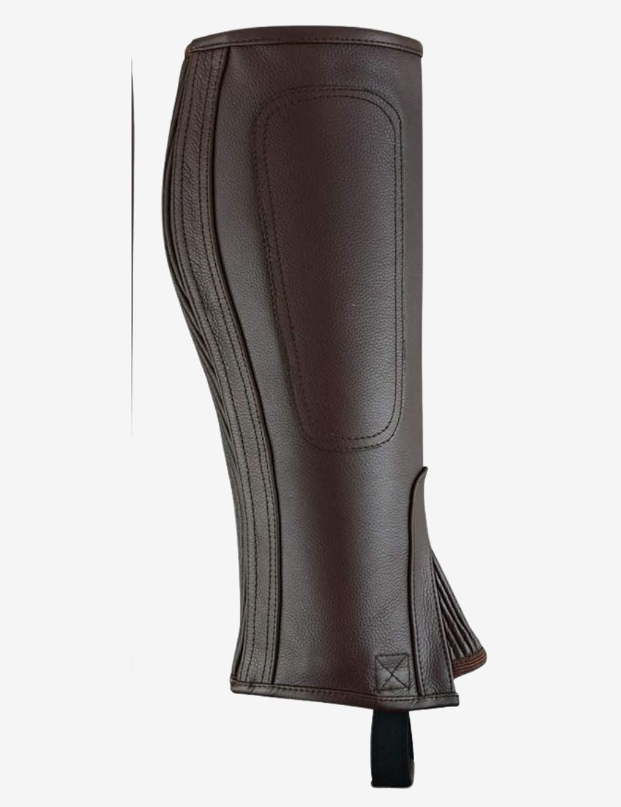 Detailed view of brown leather equestrian half chaps highlighting the reinforced inner leg panel, precision stitching, genuine leather craftsmanship, and enhanced grip
