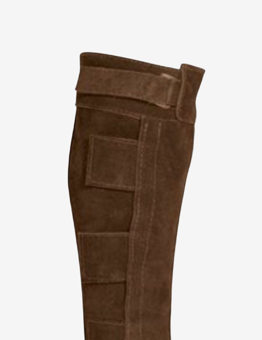 Close-up of brown suede half chaps highlighting the reinforced inner leg panel, durable stitching, and genuine leather construction