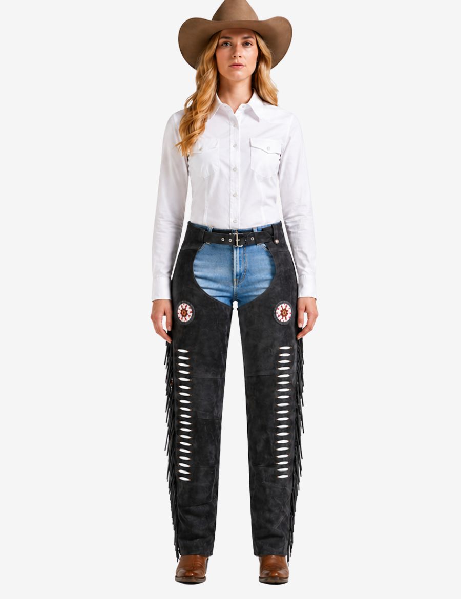 Female model wearing charcoal black western chaps for women with cowboy hat and western riding outfit.
