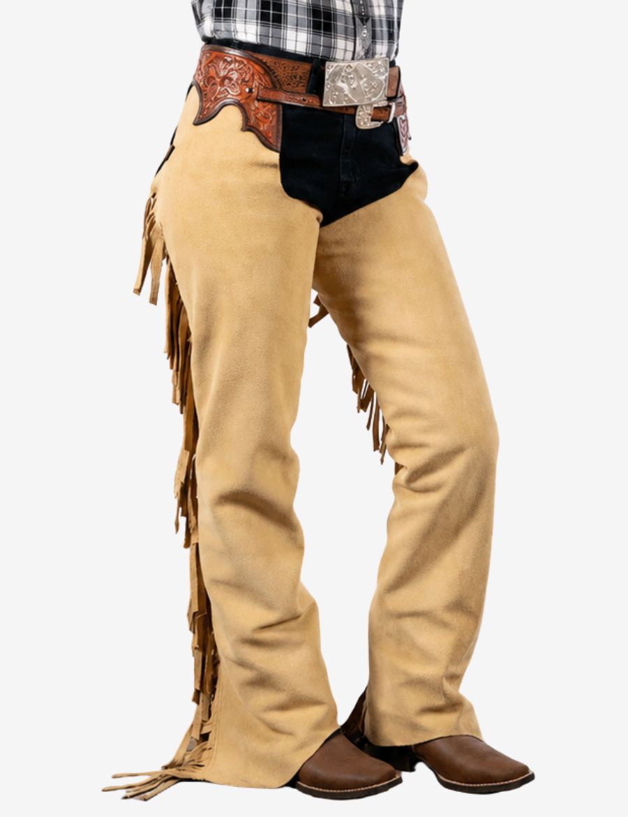 Close-up front view of beige suede western chaps featuring soft leather texture and long western fringe details.
