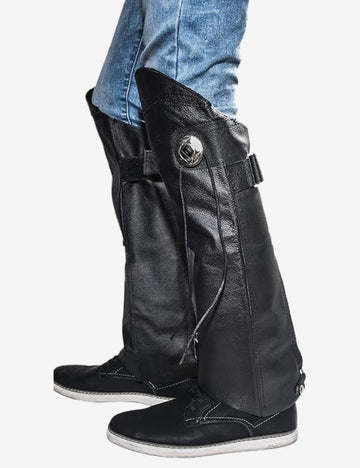 Side view of classic black motorcycle half chaps crafted from genuine leather, featuring durable construction, adjustable fit, and protective coverage for motorcycle riders