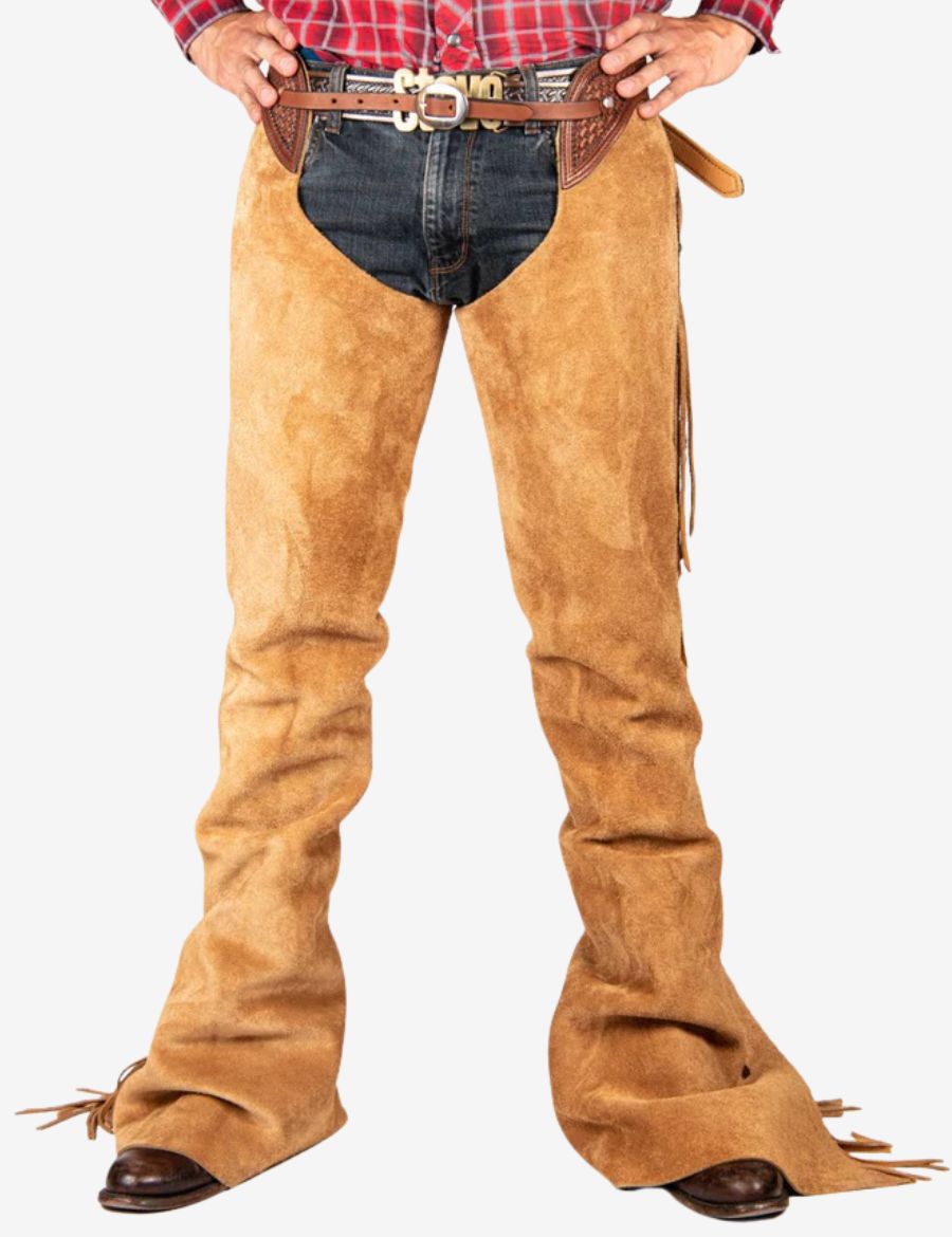 Front view of cowboy buckskin tooled show chaps in tan suede leather with western belt detailing.