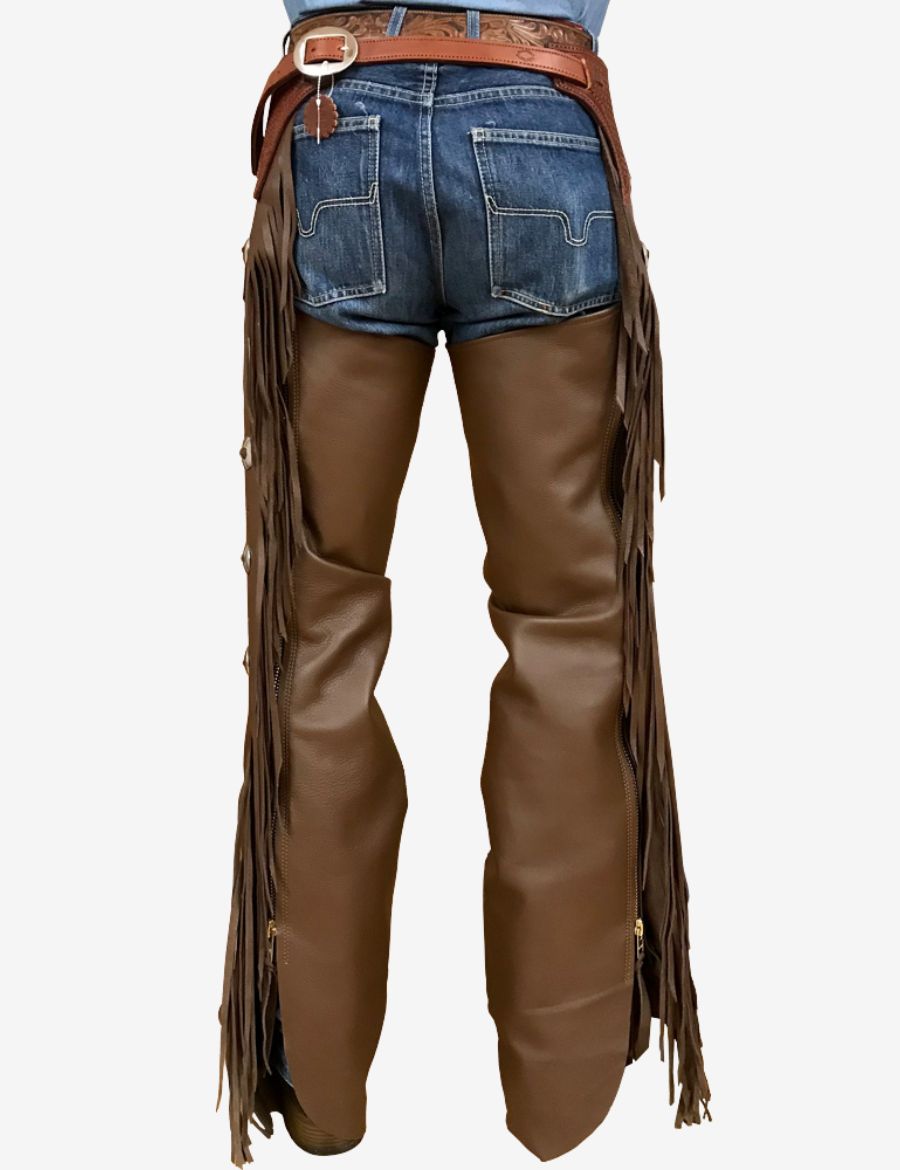 Back view of dark brown leather shotgun chaps with long side fringe and traditional western cowboy design.
