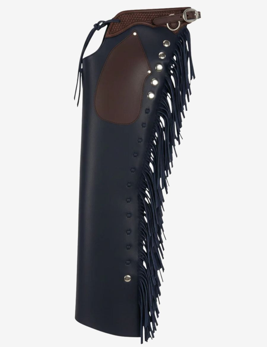 Side view of deep navy leather shotgun chaps featuring dark knee patch, silver hardware, and western fringe trim.