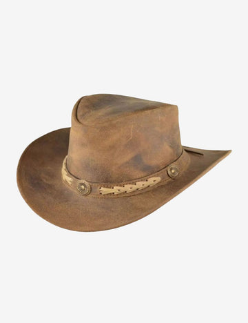 Angled front view of distressed tan leather cowboy hat featuring a vintage finish, braided leather hatband, concho details, and shaped crown.