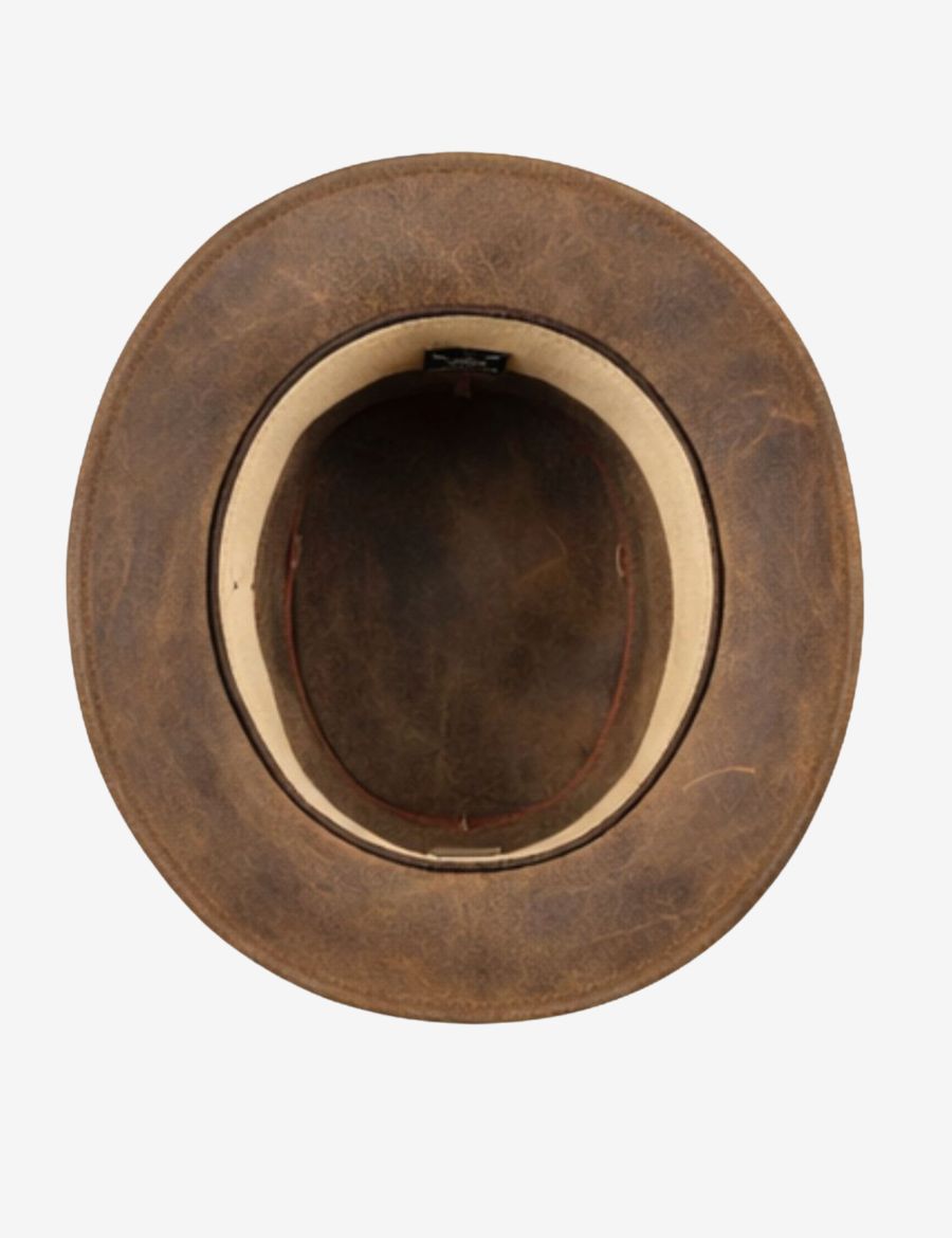 Interior top view of distressed tan leather cowboy hat showing the structured crown, wide brim, and comfortable sweatband construction.