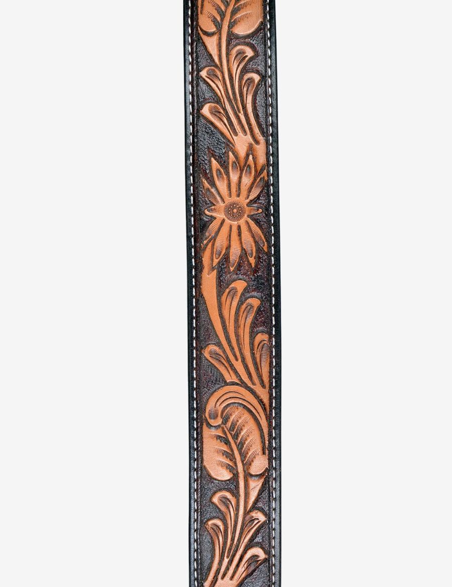 Close-up detail of floral and scroll carving on premium brown western leather belt.