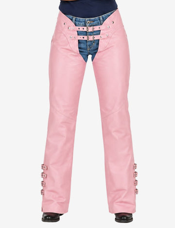 Front view of genuine leather womens pink chaps with double buckle waist and slim riding fit over jeans.