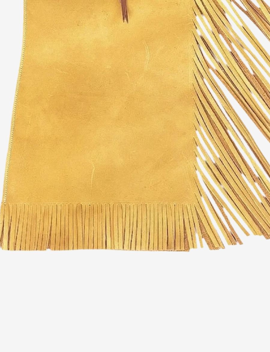 Lower leg view of golden tan bull riding chaps with long leather fringe and bottom trim detailing.