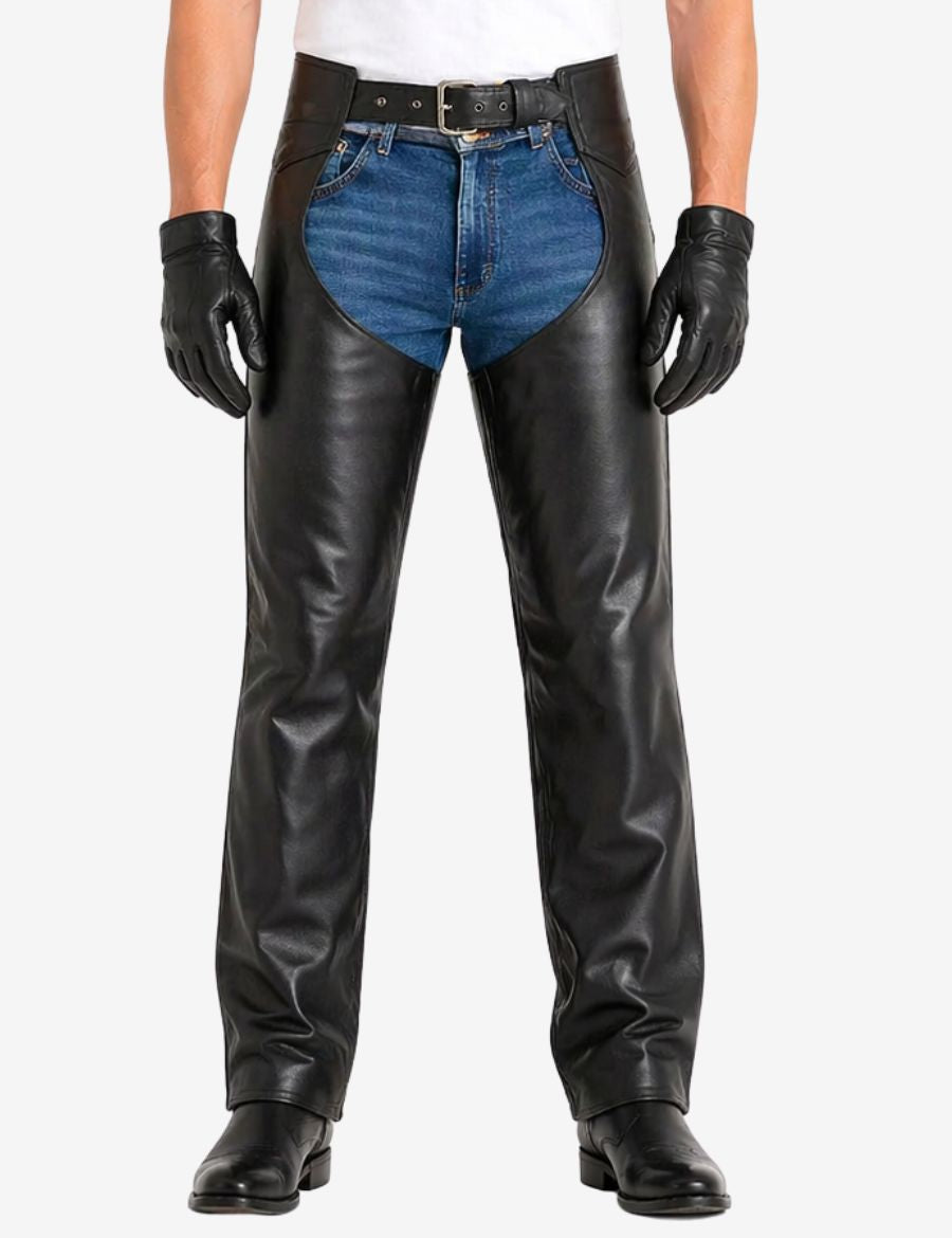 Male model wearing Havoc black motorcycle buttless chaps with biker boots and classic riding style.