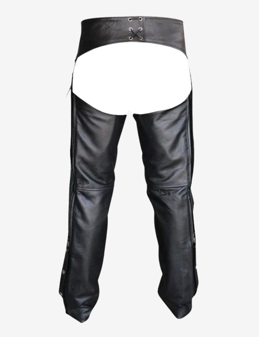 Male model wearing Havoc black motorcycle buttless chaps with biker boots and classic riding style.