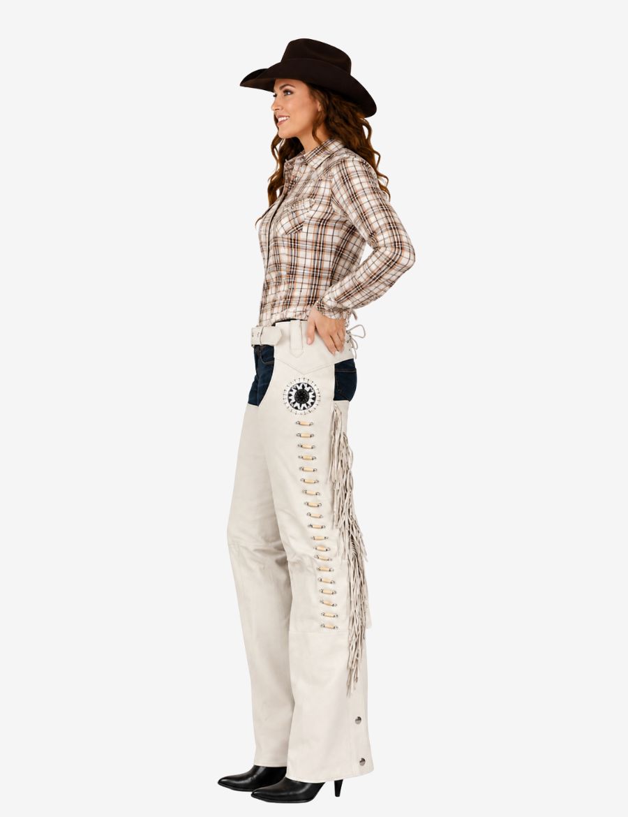 Side profile of ivory leather western show chaps with flowing fringe and decorative concho accents.