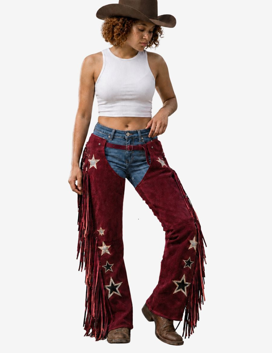 Cowgirl wearing maroon embroidered fringe cowgirl chaps featuring star accents, flowing fringe, and a stylish western fashion design.