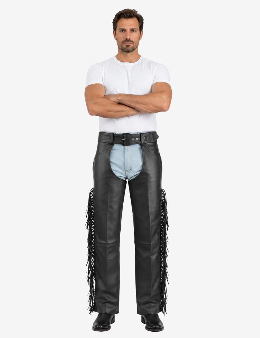 Full model wearing mens assless motorcycle chaps with fringe in genuine black leather and loose relaxed fit.
