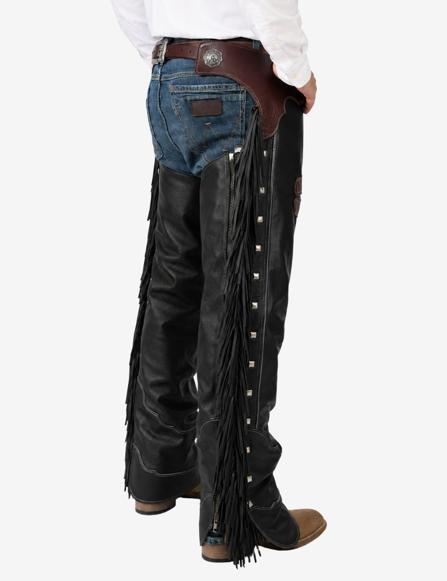 Front view of men’s black fringe leather cowboy chaps with brown yoke and classic western styling.
