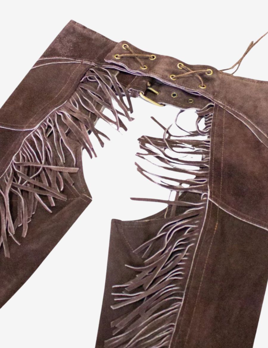 Detailed close-up of brown suede western chaps featuring side zipper and long leather fringe trim.