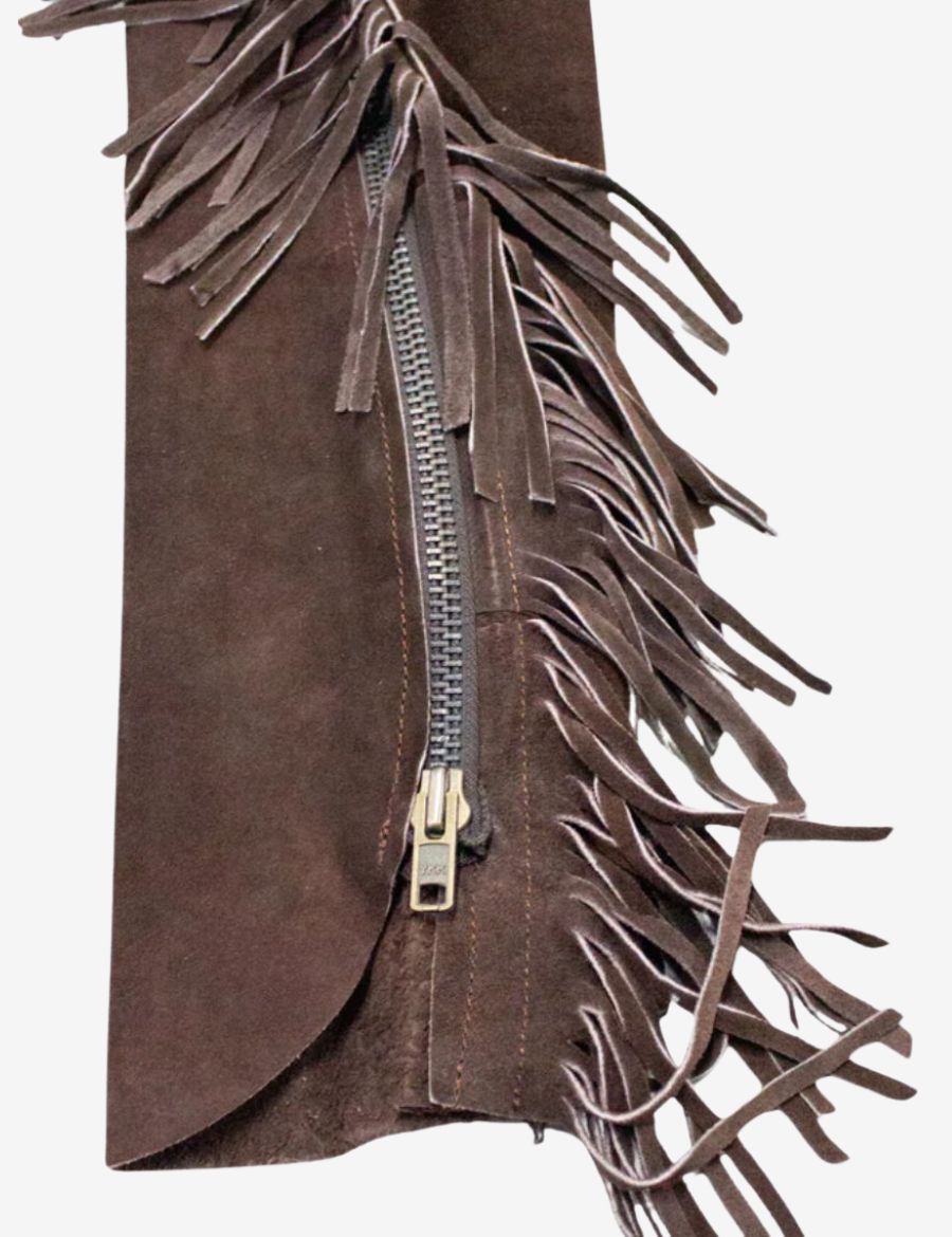 Close-up of leg zipper on mens brown suede fringe chaps with western leather tassel trim.