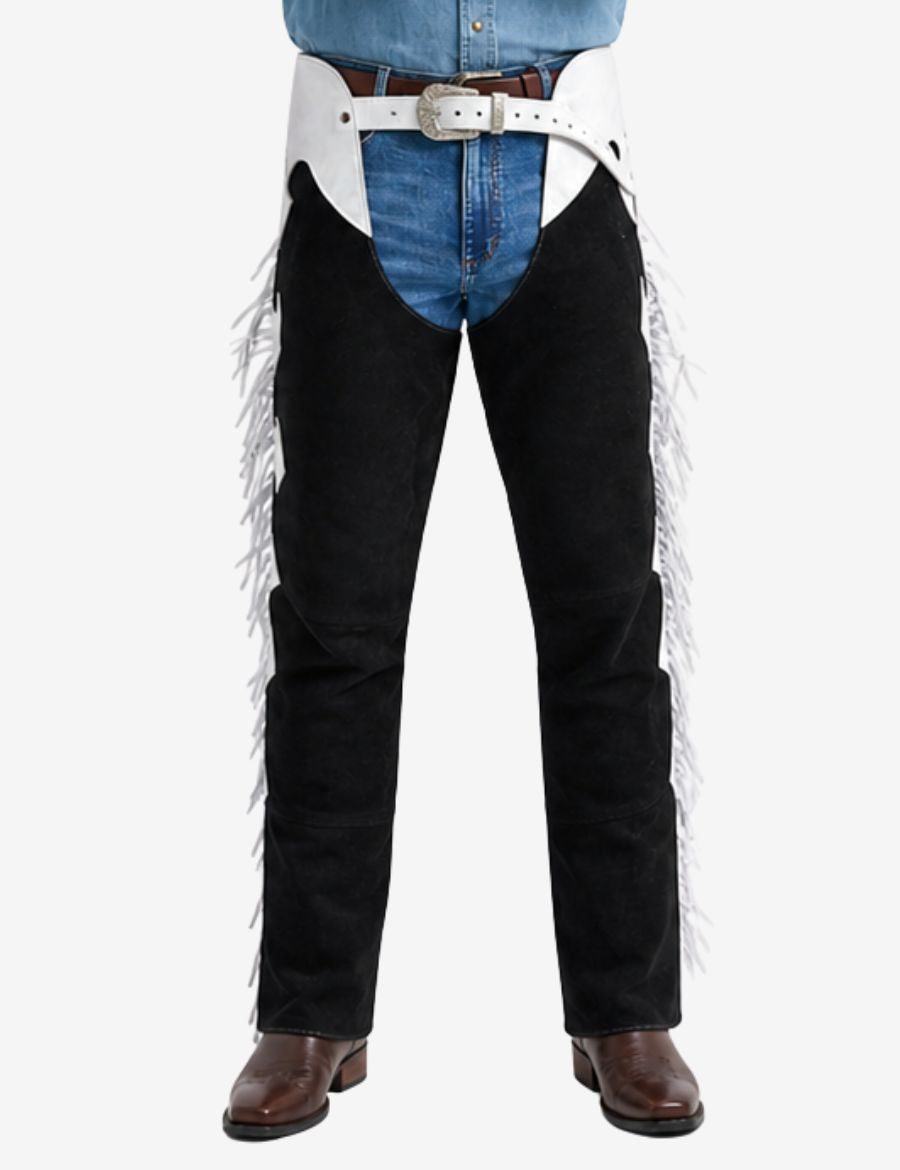 Close-up of black and white western fringe chaps featuring decorative buckle belt and leather tassels.