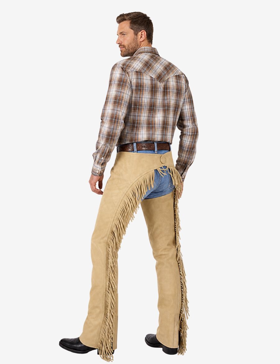 Male model back view wearing beige suede western riding chaps with long fringe and cowboy design.