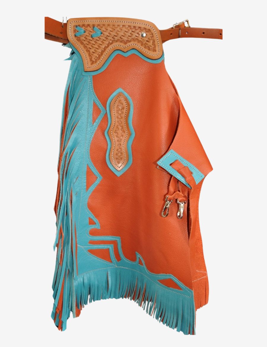 Close-up tooling detail of orange bull riding chaps featuring basket weave leather carving and turquoise accents.