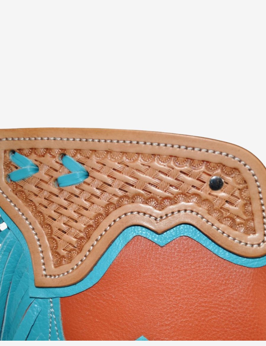 Inside view of orange leather bull riding chaps with turquoise trim, adjustable leg straps, and western fringe detailing.