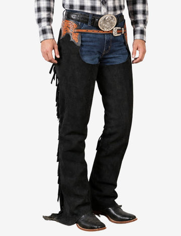 Front lower angle of black suede western chaps featuring smooth leg contours, fringe trim, and cowboy boot styling.