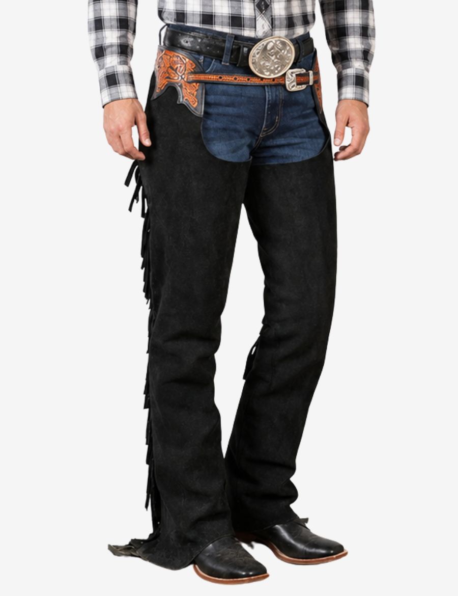 Front lower angle of black suede western chaps featuring smooth leg contours, fringe trim, and cowboy boot styling.