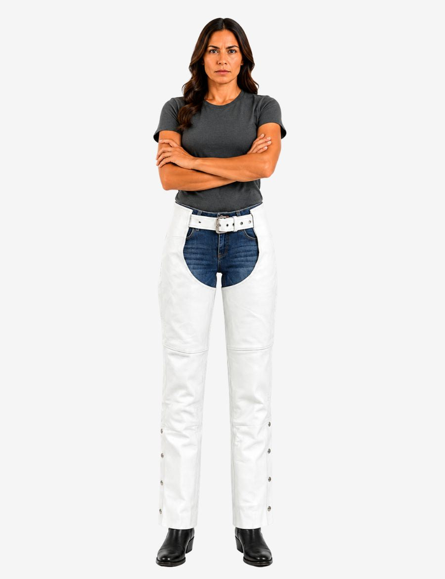 Full body front view of white leather women’s chaps showing belt waistband, open-front riding design, and protective leg coverage over denim jeans.