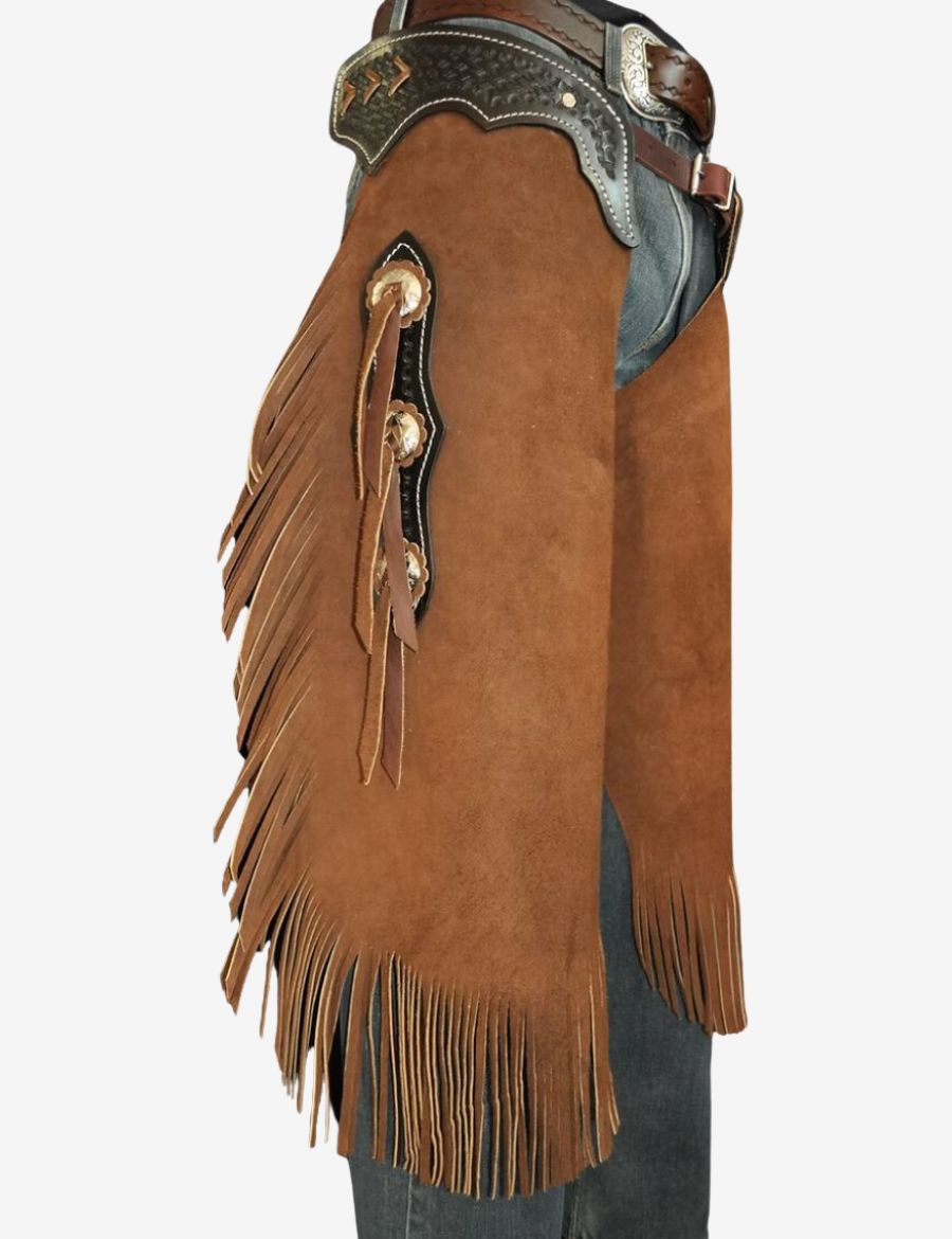 Side view of ranch rider suede chinks chaps worn with jeans featuring fringe leather and western rodeo design.