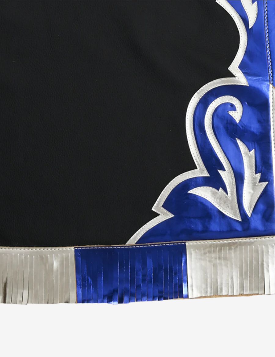 Detailed fringe view of black leather rodeo chaps showcasing layered blue and silver metallic western fringe accents.