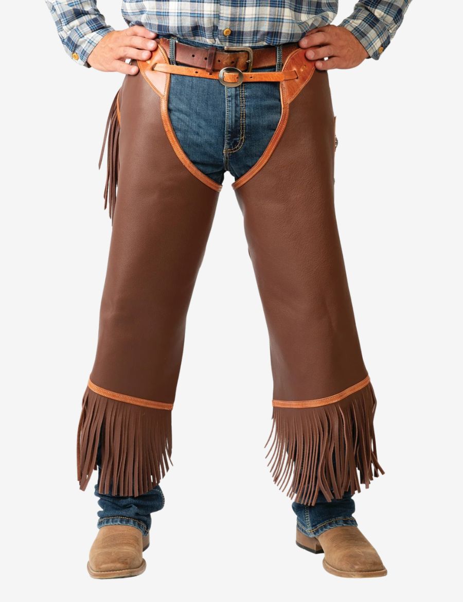 Back side model view of saddle brown concho chinks chaps with silver conchos, fringe accents, and western leatherwork.