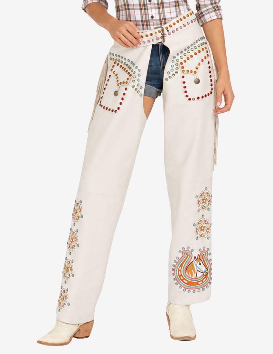 white cowgirl chaps featuring colorful stud embellishments and western inspired artwork.