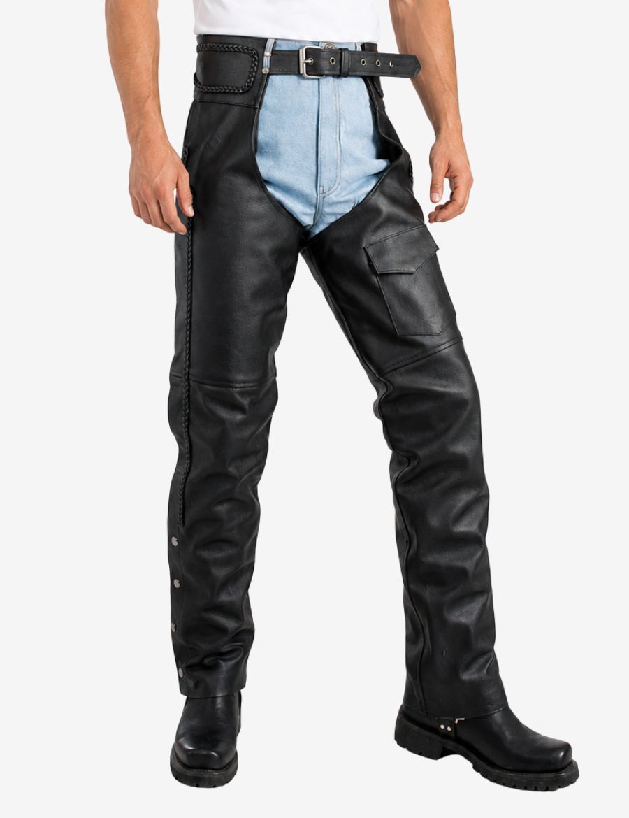 Angled front view of black utility braided leather chaps for men with side braiding and flap Utility pocket.